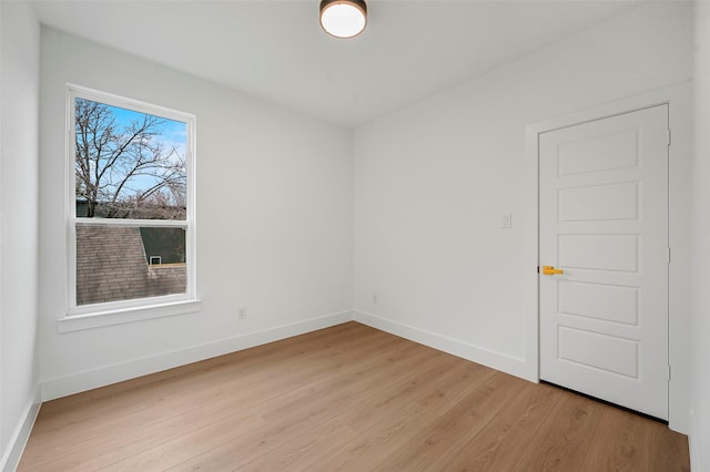 unfurnished room with plenty of natural light and light hardwood / wood-style floors