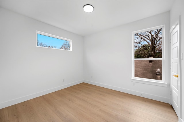 unfurnished room featuring light hardwood / wood-style flooring