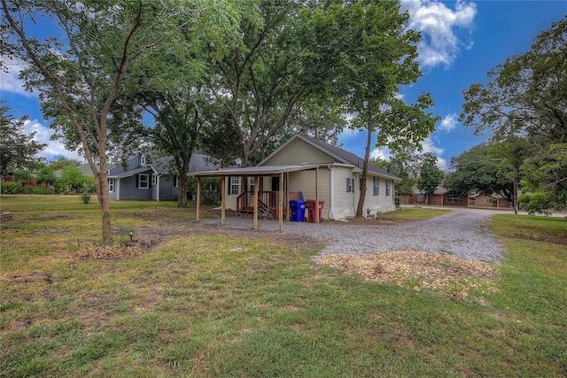 rear view of property with a yard and covered porch