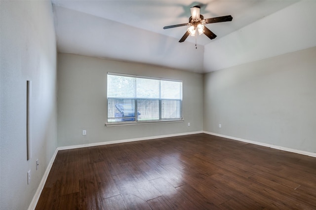 unfurnished room featuring lofted ceiling, dark wood-type flooring, and ceiling fan