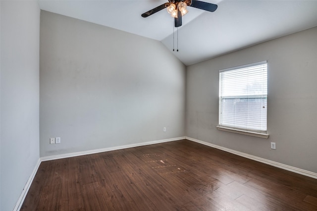 spare room featuring ceiling fan, lofted ceiling, and dark hardwood / wood-style floors