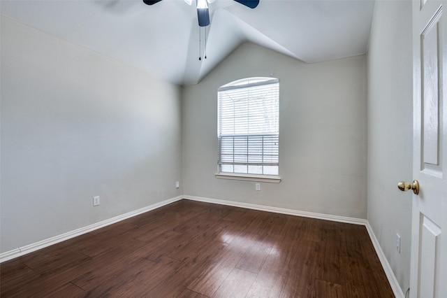 unfurnished room featuring lofted ceiling, dark hardwood / wood-style floors, and ceiling fan