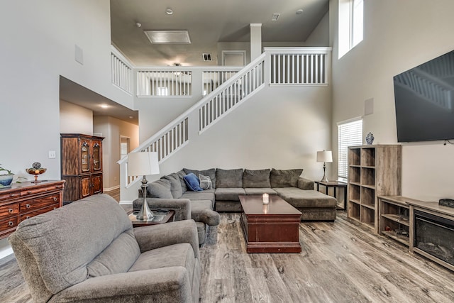 317 Countryside Dr, Aubrey, TX 76227 - living room with a high ceiling, wood finished floors, stairs, and attic access