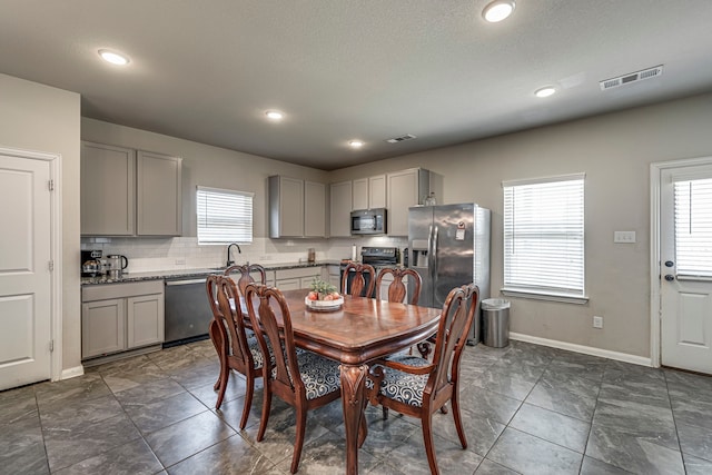 dining area featuring sink