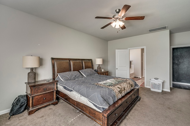 bedroom featuring light colored carpet and ceiling fan