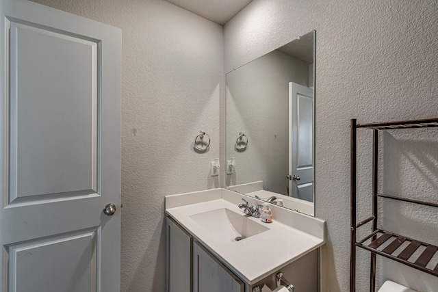 317 Countryside Dr, Aubrey, TX 76227 - bathroom featuring a textured wall and vanity