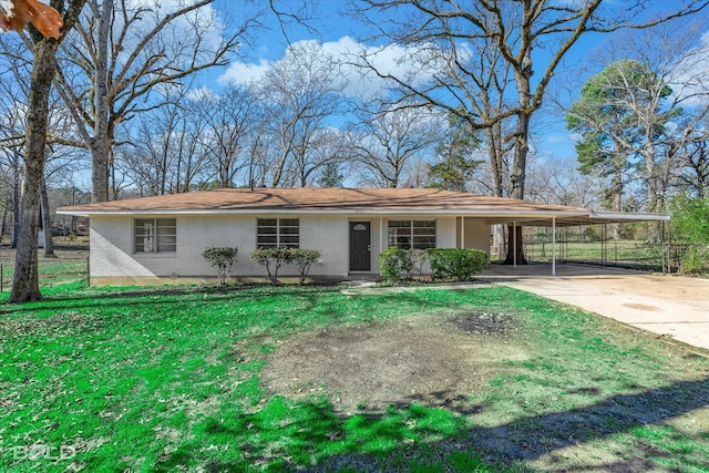 single story home with a front lawn and a carport