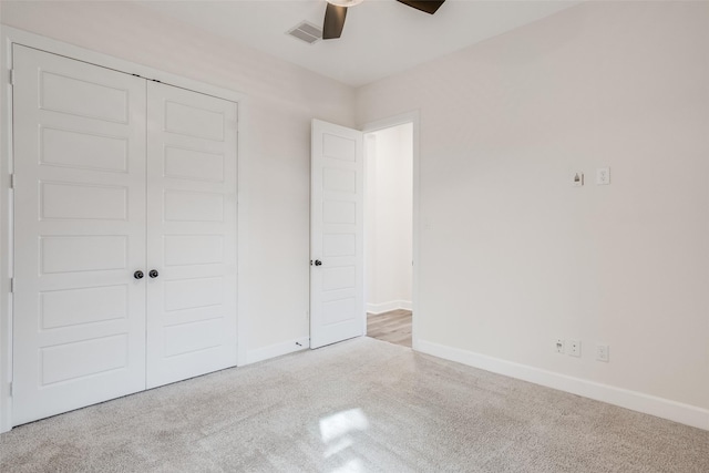 unfurnished bedroom featuring a ceiling fan, baseboards, visible vents, and a closet