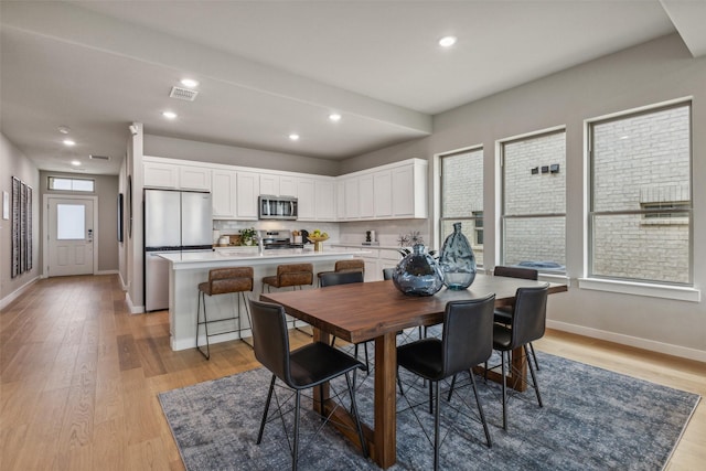 dining room featuring light hardwood / wood-style flooring