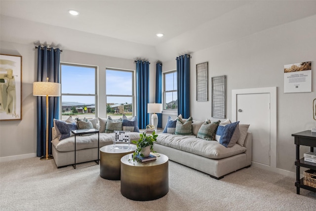 living room featuring vaulted ceiling and carpet floors