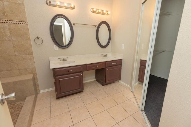 bathroom featuring tile patterned flooring and vanity