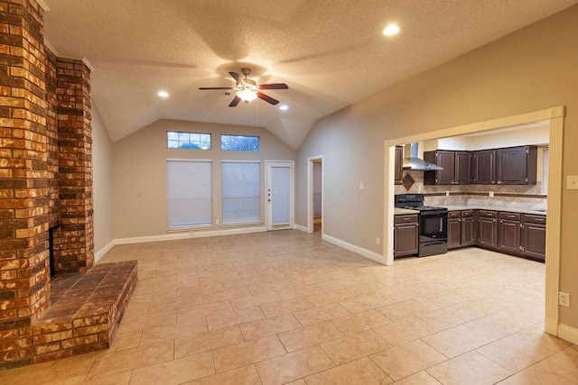 unfurnished living room featuring light tile patterned floors, ceiling fan, a textured ceiling, a brick fireplace, and vaulted ceiling