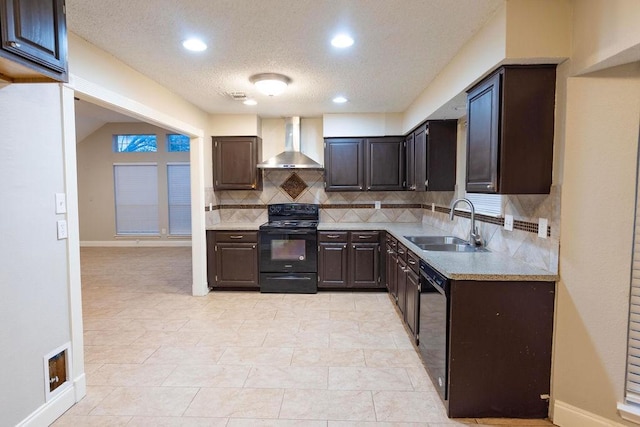 kitchen with sink, dark brown cabinets, wall chimney range hood, decorative backsplash, and black appliances