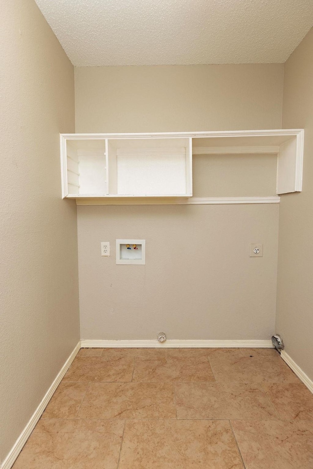 clothes washing area featuring electric dryer hookup, washer hookup, and a textured ceiling