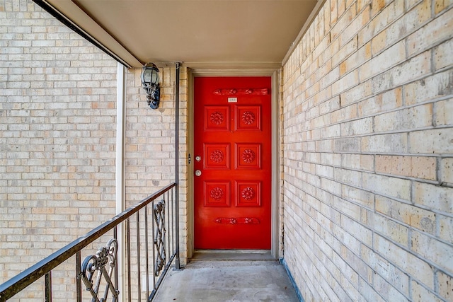 entrance to property with a balcony