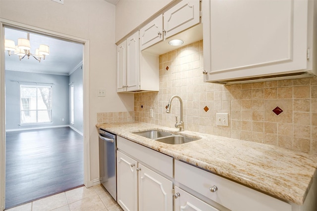 kitchen featuring light tile patterned flooring, sink, white cabinets, stainless steel dishwasher, and crown molding