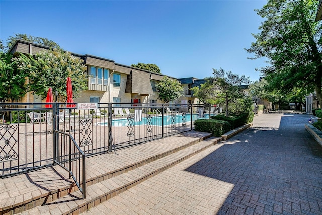 view of swimming pool featuring a patio area