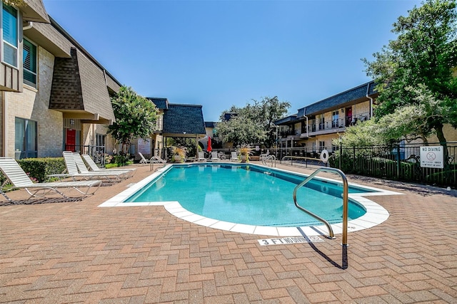 view of pool featuring a patio area