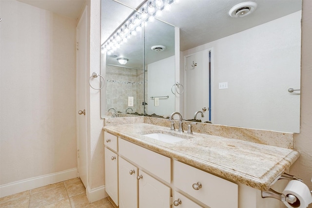 bathroom with vanity and tile patterned floors