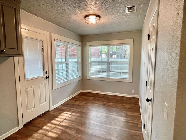 doorway to outside featuring dark hardwood / wood-style floors