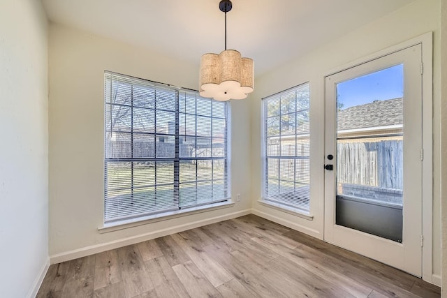 unfurnished dining area featuring light hardwood / wood-style floors