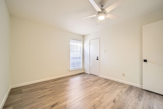 unfurnished room with ceiling fan and light hardwood / wood-style flooring