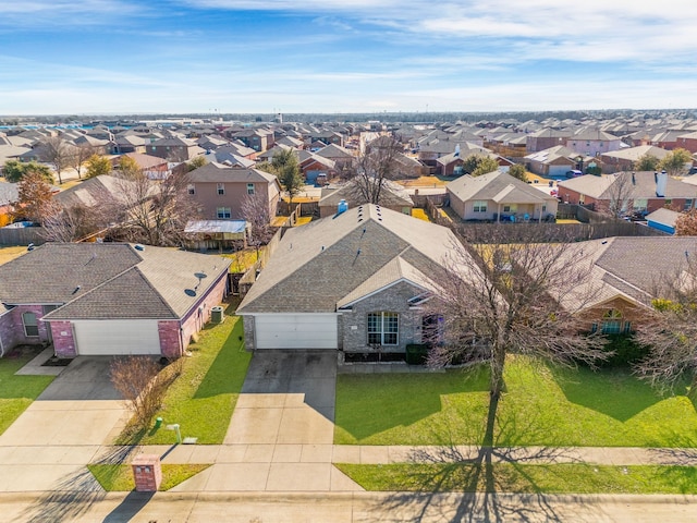 birds eye view of property with a residential view