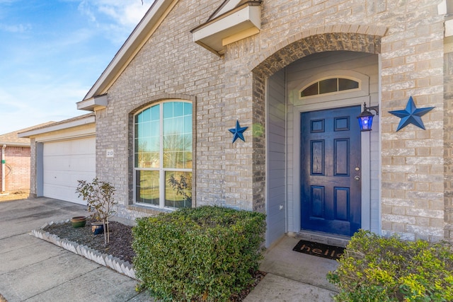 view of exterior entry featuring a garage