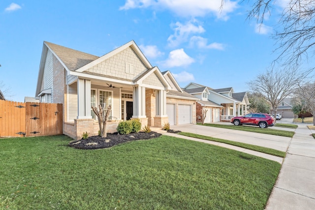 craftsman house with a garage, a front yard, ceiling fan, and covered porch