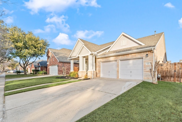 view of front of house with a garage and a front yard