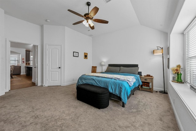 carpeted bedroom with lofted ceiling and ceiling fan