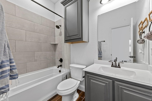 full bathroom featuring vanity, wood-type flooring, toilet, and shower / bath combo