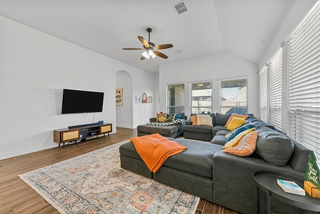 living room with ceiling fan, lofted ceiling, and dark hardwood / wood-style floors