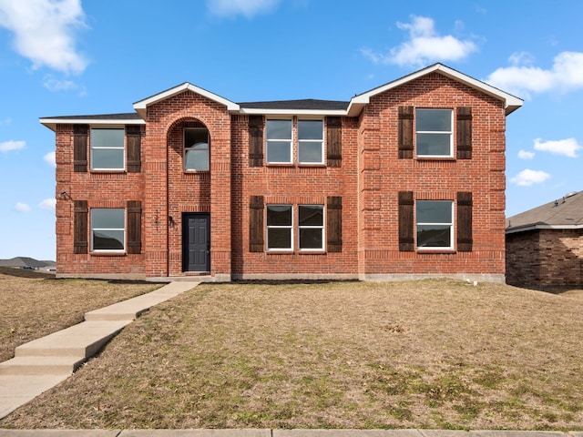 view of front of home featuring a front lawn