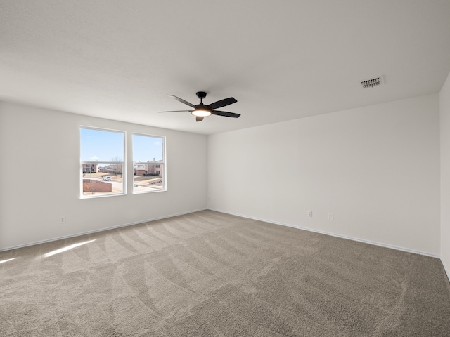 unfurnished room featuring carpet floors and ceiling fan