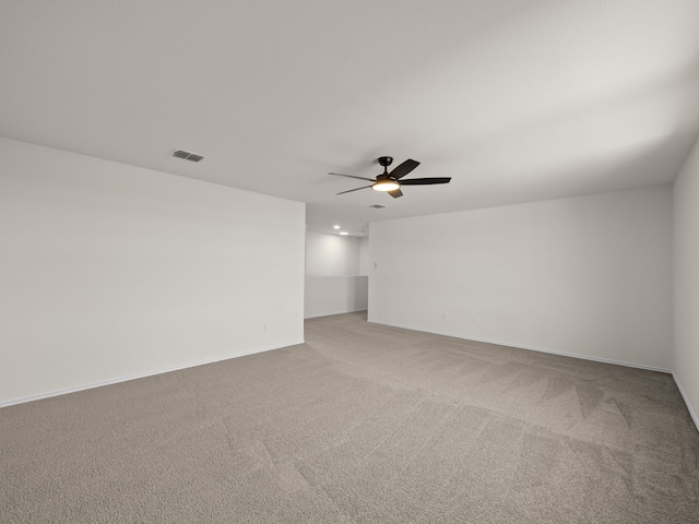 carpeted empty room with ceiling fan