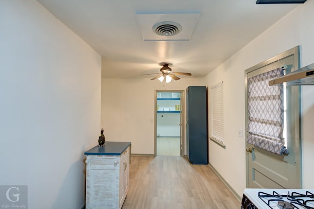 hall with light wood-type flooring and visible vents