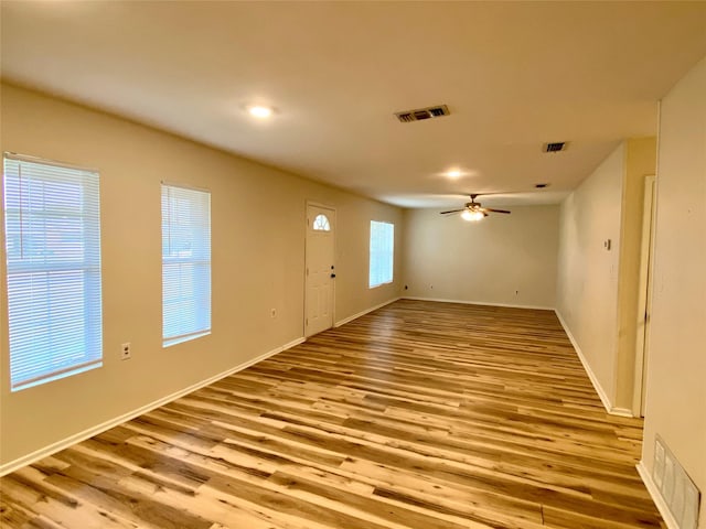 interior space with ceiling fan and light wood-type flooring