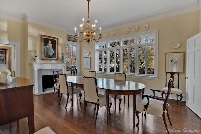 dining room with a notable chandelier, crown molding, and dark hardwood / wood-style floors