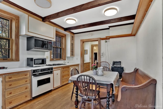 kitchen featuring light hardwood / wood-style flooring, oven, and gas cooktop