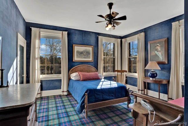 carpeted bedroom featuring ceiling fan