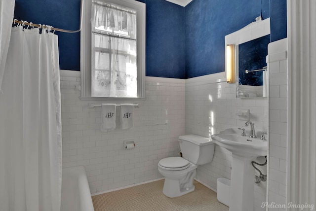 full bathroom with toilet, sink, separate shower and tub, tile walls, and tile patterned flooring