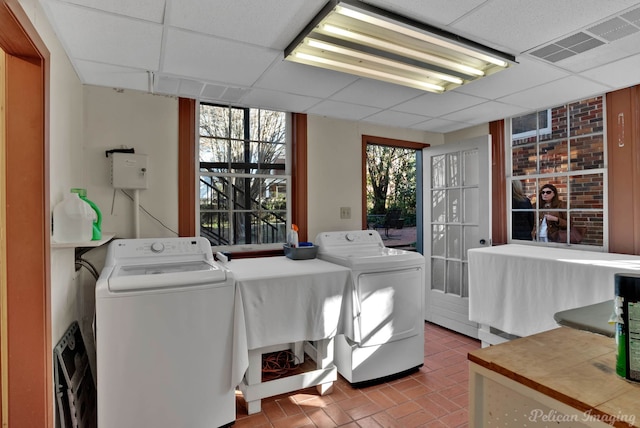 clothes washing area with independent washer and dryer