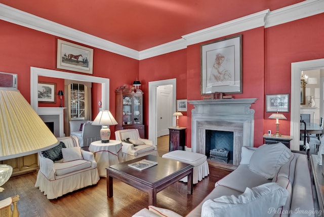 living room featuring ornamental molding and dark hardwood / wood-style flooring