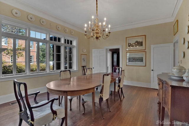 dining room with an inviting chandelier, ornamental molding, wood-type flooring, and a wealth of natural light