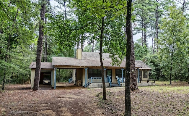 ranch-style house featuring a sunroom and covered porch