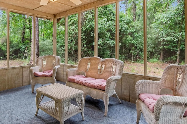 sunroom featuring ceiling fan