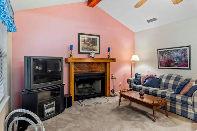 carpeted living room featuring vaulted ceiling with beams and ceiling fan