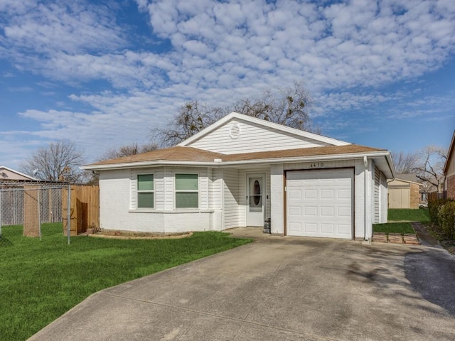 ranch-style home featuring a garage and a front yard