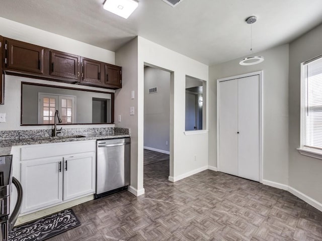 kitchen with sink, dark brown cabinets, light parquet flooring, dishwasher, and a healthy amount of sunlight